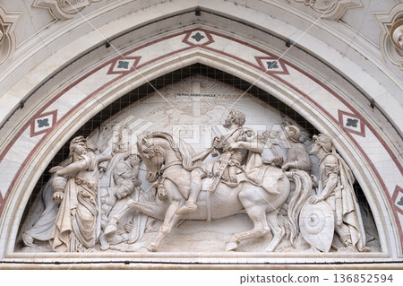 Sculpted lunette containing a scene depicting the Vision of Constantine, by Emilio Zocchi, over the right door of Basilica di Santa Croce famous Franciscan church in Florence Sculpted lunette containing a scene depicting the Vision of Constantine, by Emilio Zocchi, over the right door of Basilica di Santa Croce famous Franciscan church in Florence 136852594