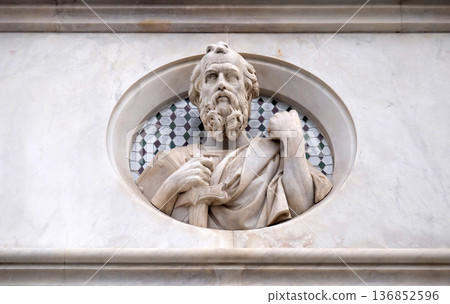 Saint, relief on the facade of Basilica di Santa Croce (Basilica of the Holy Cross) - famous Franciscan church in Florence, Italy Saint, relief on the facade of Basilica di Santa Croce (Basilica of the Holy Cross) - famous Franciscan church in Florence, Italy 136852596