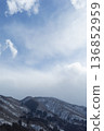 Blue sky and snowy mountains - Winter mountain range and cloud scenery 136852959