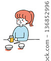 A woman having a drink alone 136852996