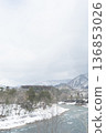 Snowy river and mountain ranges: A winter river landscape with space 136853026