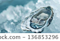 Fresh open oyster served on a bed of crushed ice, highlighting gourmet seafood and fine dining quality. 136853296