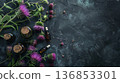 Milk thistle flowers and herbal tincture bottles on dark rustic background, natural remedy concept 136853301