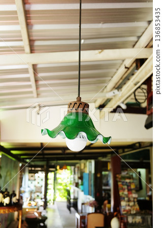 Vintage green lamp hang above on ceiling of an abandoned house in Thailand Vintage green lamp hang above on ceiling of an abandoned house in Thailand 136853435