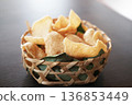 Fresh Prawn Crackers on woven basket delight 136853449