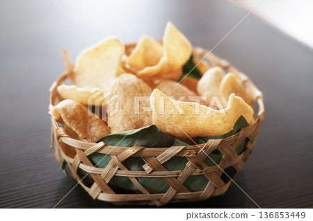 Fresh Prawn Crackers on woven basket delight 136853449