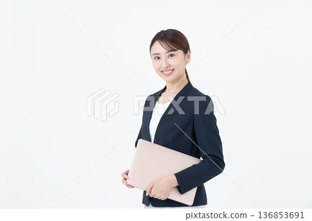 Businesswoman with laptop on white background 136853691