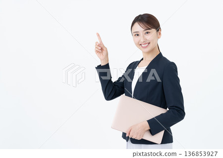 Businesswoman with laptop on white background 136853927