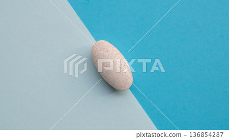 Herbal medicine pill tablet on blue and white background Herbal medicine pill tablet on blue and white background 136854287