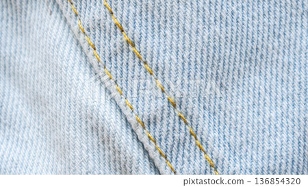 Old denim blue jeans fabric texture background close up 136854320