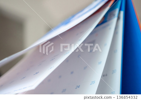 Abstract blur calendar page flipping sheet close up background business schedule planning appointment meeting concept Abstract blur calendar page flipping sheet close up background business schedule planning appointment meeting concept 136854332