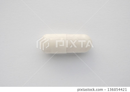 White medicine pill capsule on white background White medicine pill capsule on white background 136854421
