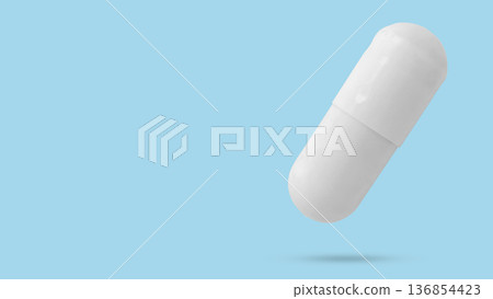 White medicine pill capsule float on blue background White medicine pill capsule float on blue background 136854423