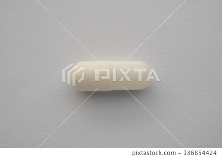 White medicine pill capsule on white background White medicine pill capsule on white background 136854424