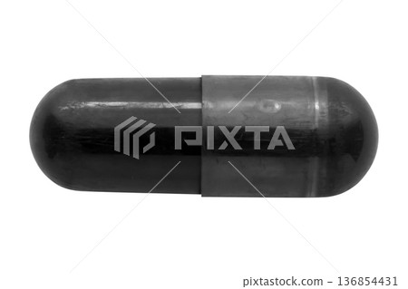 Black medicine pill activated charcoal capsule isolated on white background Black medicine pill activated charcoal capsule isolated on white background 136854431