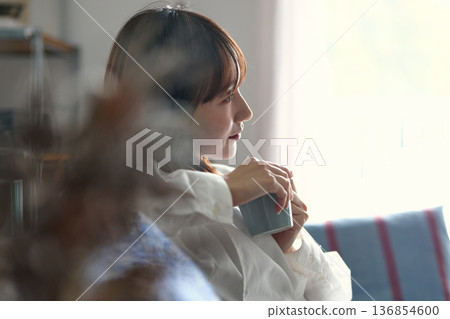 A woman relaxing on the sofa 136854600