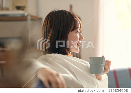 A woman relaxing on the sofa 136854608