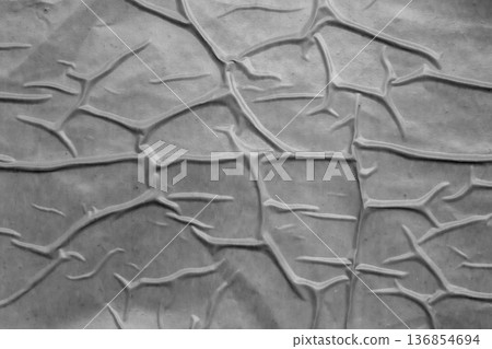 Gray crumpled and creased plastic poster texture background 136854694