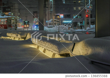 Beautifully repainted snowscape in front of Toyama Station amid heavy snowfall, and the tram running safely Beautifully repainted snowscape in front of Toyama Station amid heavy snowfall, and the tram running safely 136855388