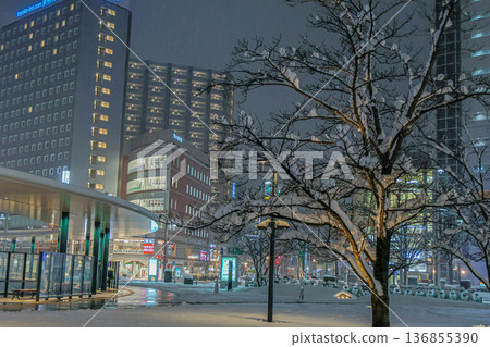 Beautifully repainted snowscape in front of Toyama Station amid heavy snowfall, and the tram running safely Beautifully repainted snowscape in front of Toyama Station amid heavy snowfall, and the tram running safely 136855390