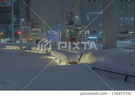 Beautifully repainted snowscape in front of Toyama Station amid heavy snowfall, and the tram running safely Beautifully repainted snowscape in front of Toyama Station amid heavy snowfall, and the tram running safely 136855391