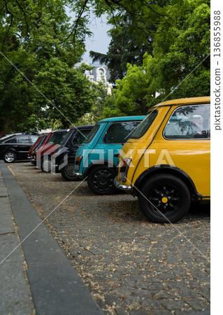 row of small bright cars in a parking lot in Batumi, Georgia 136855988