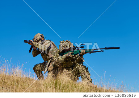 Soldiers Sniper And Spotter In Camouflage Training On Hill With Tactical Rifles And Teamwork 136856619