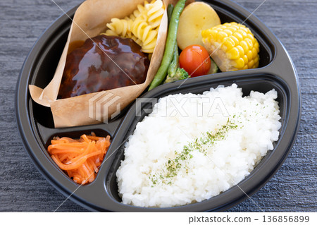 Delicious hamburger bento with vegetables Delicious hamburger bento with vegetables 136856899