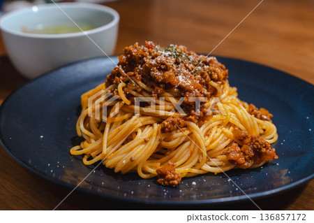 Close-up of spaghetti showing the texture of the meat sauce and noodles Close-up of spaghetti showing the texture of the meat sauce and noodles 136857172