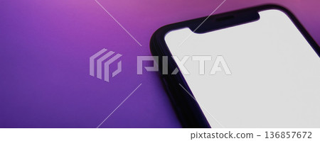 Wide banner of mobile phone with bright isolated screen on neon background Wide banner of mobile phone with bright isolated screen on neon background 136857672