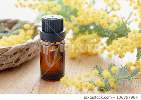Aroma oil and mimosa flowers Aroma oil and mimosa flowers 136857967