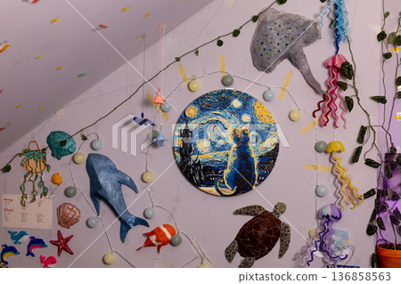 Creative room display of ocean-themed decorations and art on the wall Creative room display of ocean-themed decorations and art on the wall 136858563