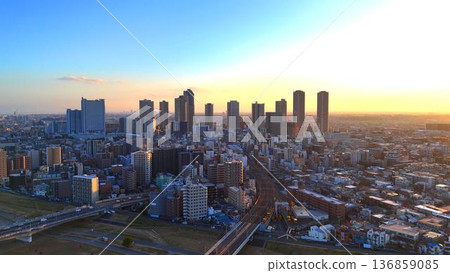 Musashi-Kosugi tower apartment complex and riverbank in the evening 136859085