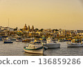 Boats in front of Marsaxlokk harbor, Malta. 136859286