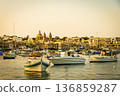 Boats in the port of Marsaxlokk with the Church of Our Lady of Pompeii in the background. Malta. 136859287
