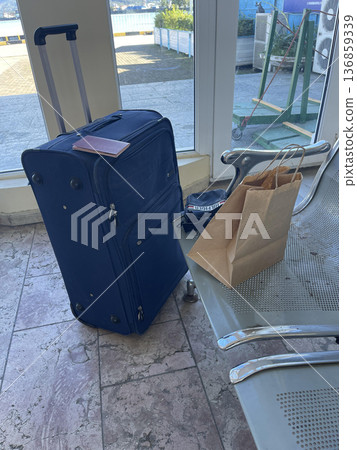 bag and suitcase in the waiting room 136859339