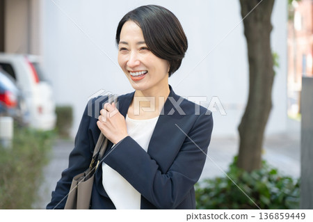 A woman in a suit A woman in a suit 136859449