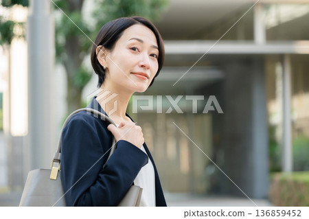A woman in a suit A woman in a suit 136859452