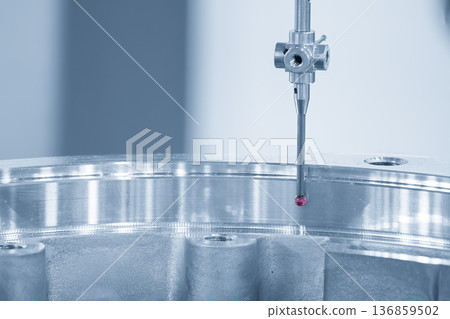 Quality inspection of a precision aluminum component using a Coordinate Measuring Machine (CMM) with a modular tactile probe. 136859502