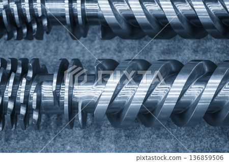 Macro view of a high-performance injection molding screw featuring optimized flight geometry for thermoplastic homogenization. Macro view of a high-performance injection molding screw featuring optimized flight geometry for thermoplastic homogenization. 136859506