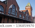 Historic brick building with clock tower in the city during daytime 136859970
