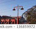 Vintage street light stands by bridge during morning in city 136859972