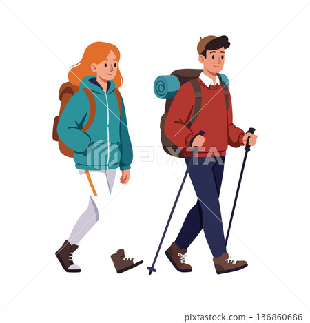 Young hikers trekking with backpacks and walking sticks in cold weather outdoor adventure activity 136860686
