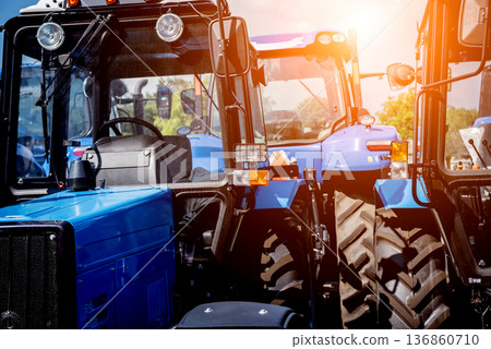 Rows of modern tractors. Industrial details. Agricultural Rows of modern tractors. Industrial details. Agricultural 136860710