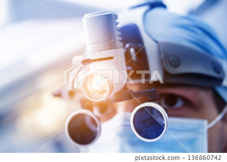 Portrait of spinal surgeon in operating room with surgery equipment. 136860742