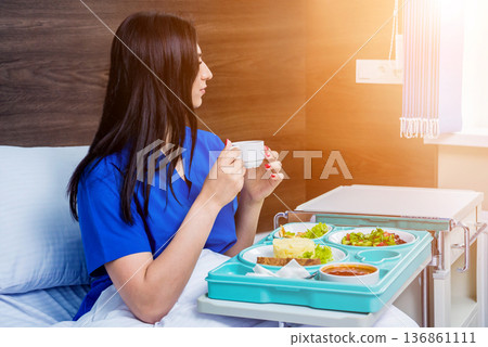 Tray with breakfast for the young female patient. Tray with breakfast for the young female patient. 136861111