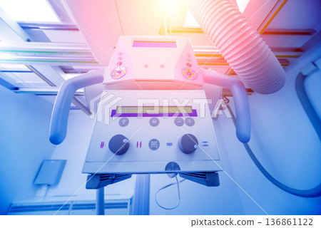 X-ray room in a hospital. Classic ceiling-mounted x-ray system. X-ray room in a hospital. Classic ceiling-mounted x-ray system. 136861122