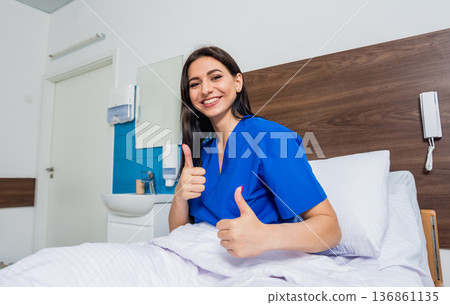Patient in a hospital bed. Young caucasian woman. Patient in a hospital bed. Young caucasian woman. 136861135