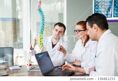 Doctors team having medical council in hospital. Doctors team having medical council in hospital. 136861253