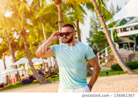 Young man on a tropical beach. Summer Young man on a tropical beach. Summer 136861367